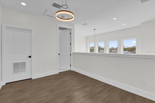 empty room with dark wood-type flooring