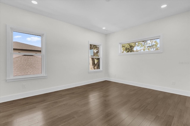 empty room with dark hardwood / wood-style floors