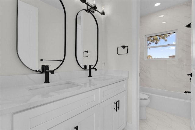 full bathroom featuring vanity, toilet, and tiled shower / bath combo