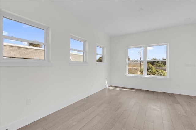 unfurnished room featuring light wood-type flooring