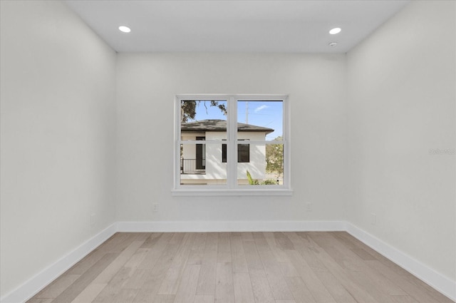 empty room with light hardwood / wood-style floors