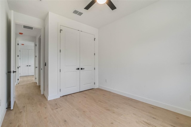 unfurnished bedroom featuring a closet, ceiling fan, and light hardwood / wood-style floors