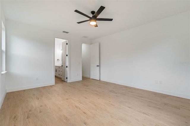 unfurnished bedroom with light hardwood / wood-style flooring, connected bathroom, and ceiling fan