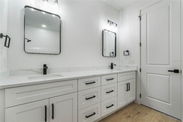 bathroom with vanity and hardwood / wood-style floors