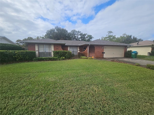 ranch-style home with a garage and a front yard