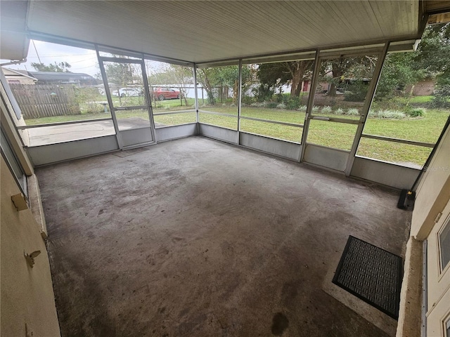 unfurnished sunroom with a wealth of natural light