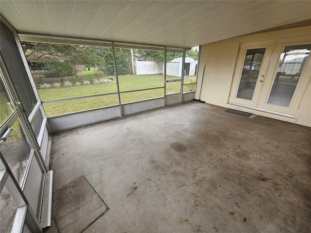 unfurnished sunroom featuring french doors and plenty of natural light