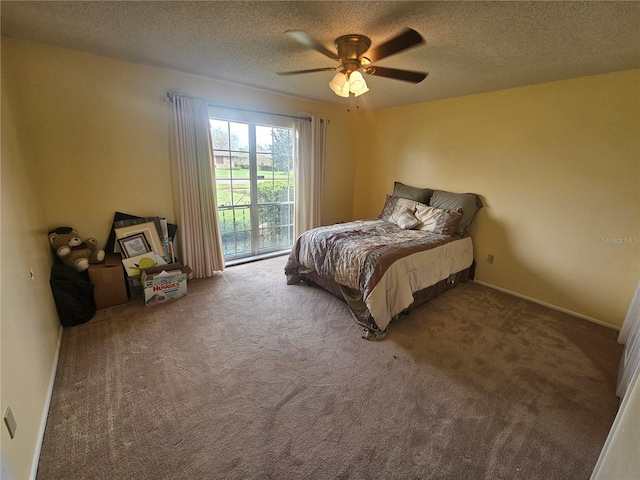 carpeted bedroom with a textured ceiling, ceiling fan, and access to exterior