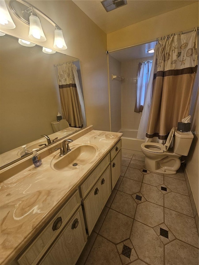 full bathroom featuring tile patterned floors, vanity, toilet, and shower / bath combination with curtain