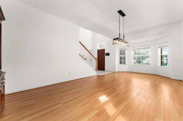 unfurnished living room featuring light hardwood / wood-style floors