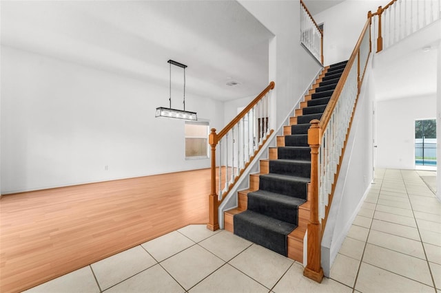 stairs with tile patterned flooring