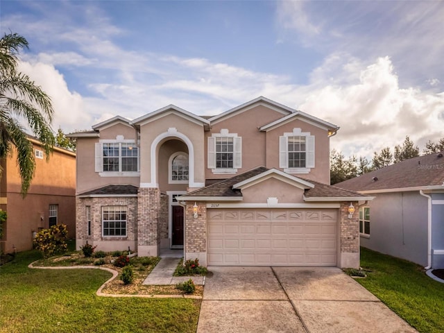 front facade with a front yard and a garage