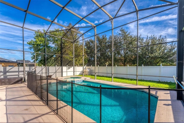 view of pool with an in ground hot tub, a patio area, and a lanai