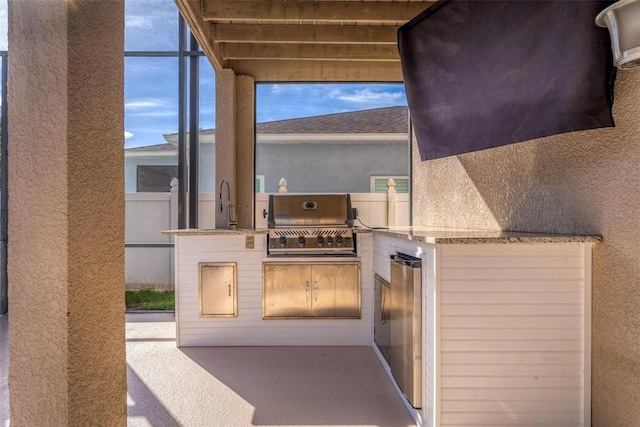 view of patio / terrace with area for grilling and sink