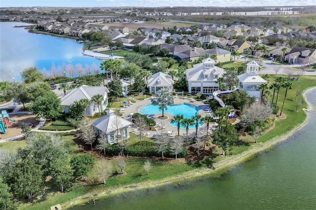 birds eye view of property with a water view