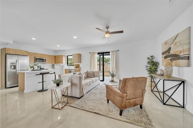 living room featuring ceiling fan