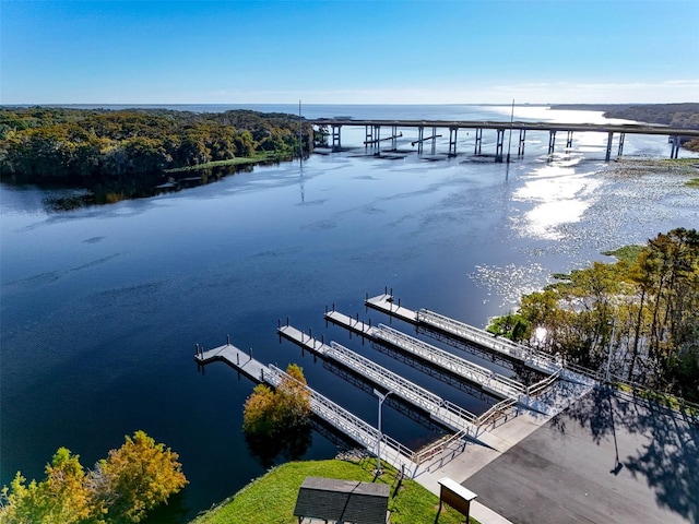 dock area featuring a water view and central air condition unit