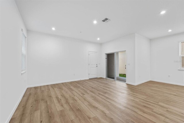 empty room with light hardwood / wood-style floors