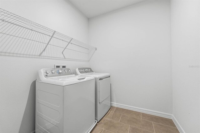 clothes washing area with washing machine and clothes dryer