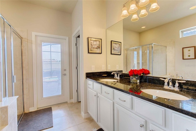 bathroom featuring vanity, walk in shower, and tile patterned floors