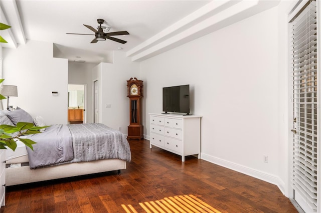 bedroom featuring a ceiling fan, connected bathroom, baseboards, and hardwood / wood-style floors