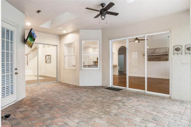 view of patio featuring ceiling fan