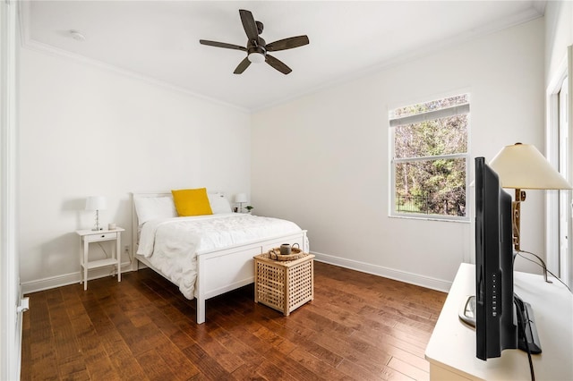 bedroom featuring baseboards, ceiling fan, hardwood / wood-style floors, and crown molding