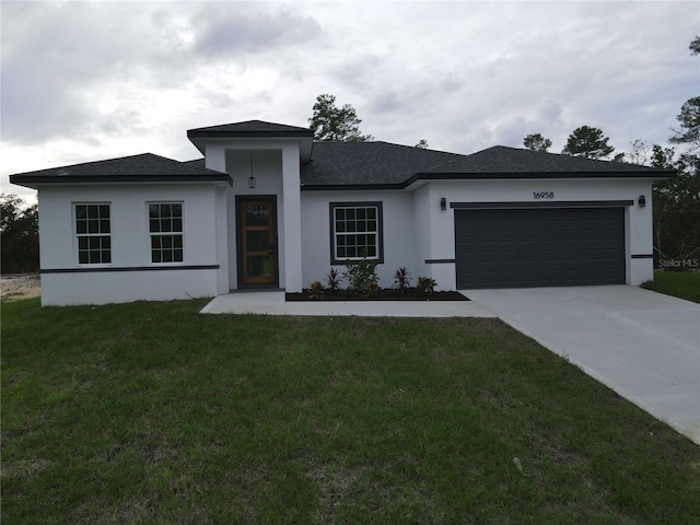 view of front facade with a garage and a front yard