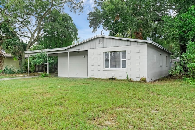 view of side of home featuring a lawn