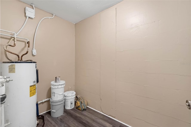 utility room featuring water heater