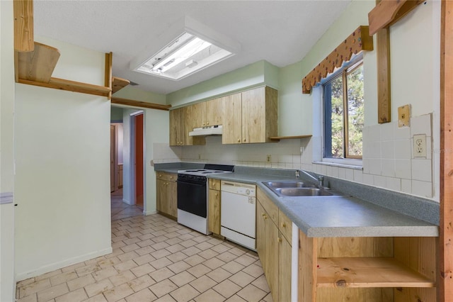 kitchen with white appliances, backsplash, and sink