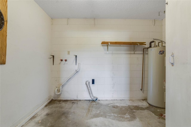 washroom featuring a textured ceiling and gas water heater