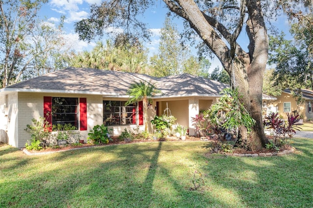 ranch-style home with a front yard