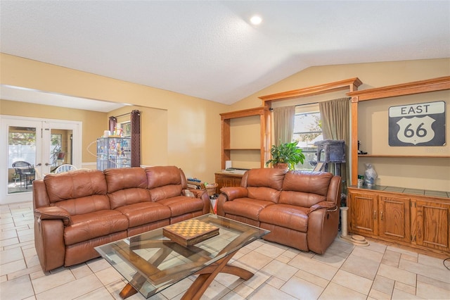 living room with french doors and vaulted ceiling