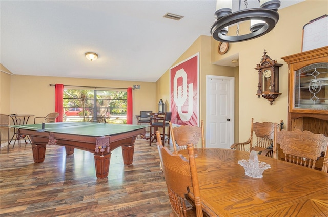 game room with dark wood-type flooring, vaulted ceiling, and billiards