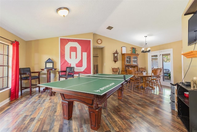 recreation room featuring dark hardwood / wood-style floors, french doors, and vaulted ceiling