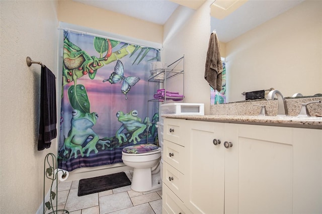 full bathroom with tile patterned floors, vanity, toilet, and shower / bath combo with shower curtain