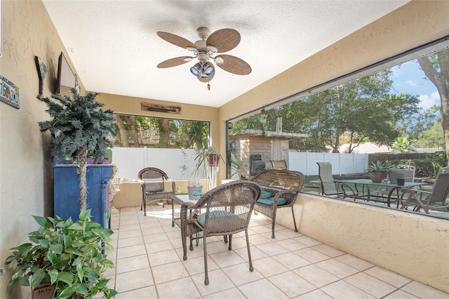 exterior space with ceiling fan