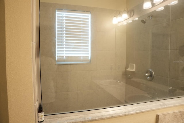 bathroom with a tile shower