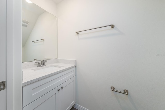 bathroom featuring baseboards and vanity