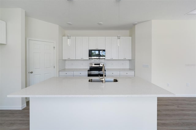 kitchen with tasteful backsplash, a sink, stainless steel electric range, and wood finished floors