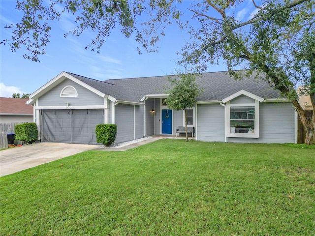 single story home with a front yard and a garage