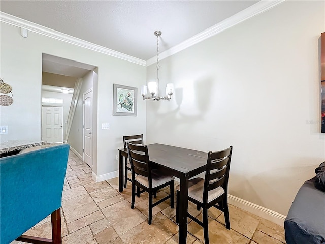 dining room with a chandelier and crown molding