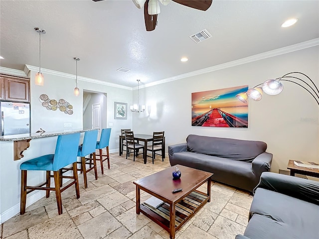 living room featuring ornamental molding and ceiling fan with notable chandelier