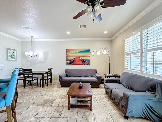 living room with ornamental molding, ceiling fan with notable chandelier, and a textured ceiling