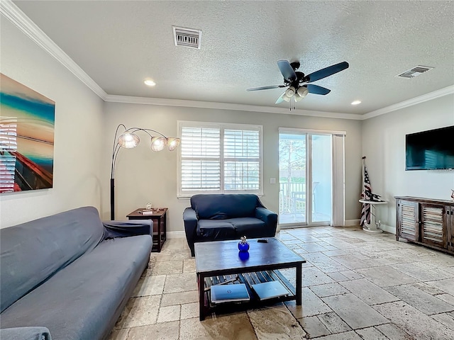 living room with ceiling fan, a textured ceiling, and ornamental molding