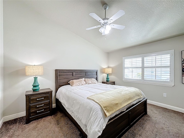 bedroom featuring a textured ceiling, ceiling fan, and dark carpet