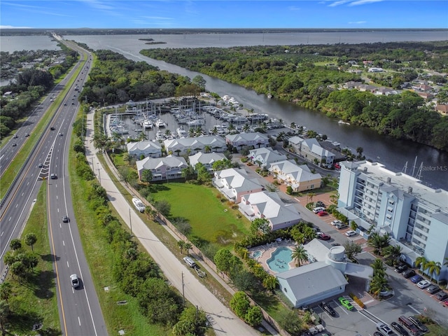 birds eye view of property with a water view