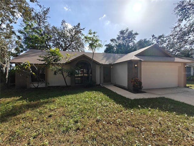 ranch-style house featuring a garage and a front lawn