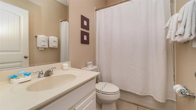 full bathroom with shower / bath combo, vanity, tile patterned floors, and toilet